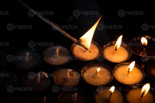 Find  the Image candle,burn,fire,men,live,spiritual,life,buddha  and other Royalty Free Stock Images of Nepal in the Neptos collection.