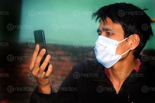 Find  the Image men,mask,coronavirus,quarantine,mobile,phone,photography  and other Royalty Free Stock Images of Nepal in the Neptos collection.