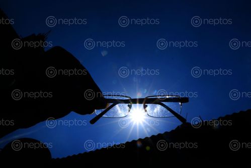 Find  the Image hand,hold,glasses,sky,sunlight,photography,sita,maya,shrestha  and other Royalty Free Stock Images of Nepal in the Neptos collection.