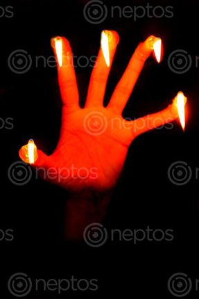 Find  the Image candle,finger#,burn#,stock,image#,nepal,_photographyby,sita,maya,shrestha  and other Royalty Free Stock Images of Nepal in the Neptos collection.