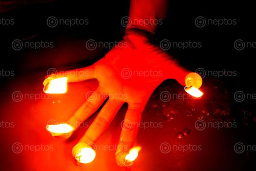 Find  the Image candle,finger#,burn#,stock,image#,nepal,_photographyby,sita,maya,shrestha  and other Royalty Free Stock Images of Nepal in the Neptos collection.