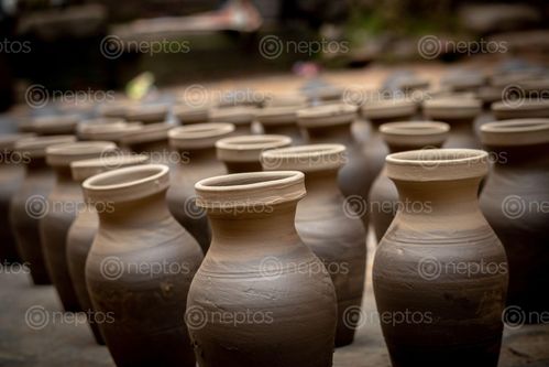 Find  the Image pots,pottery,square,bhaktapur  and other Royalty Free Stock Images of Nepal in the Neptos collection.