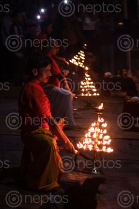 Find  the Image pujaris,lift,lamps,evening,aarati,aryaghat,pashupati  and other Royalty Free Stock Images of Nepal in the Neptos collection.