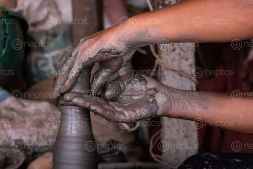 Find  the Image closeup,man,molding,soft,clay,pottery,square,bhaktapur  and other Royalty Free Stock Images of Nepal in the Neptos collection.