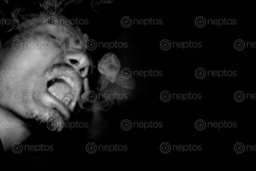 Find  the Image man,smoke,picture,natural,photography#,stock,image#,nepalphotography,sita,maya,shrestha  and other Royalty Free Stock Images of Nepal in the Neptos collection.
