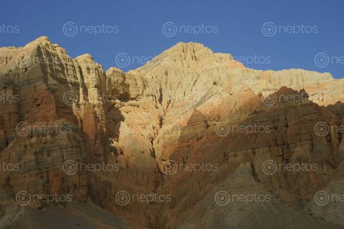 Find  the Image sunrise,dhakmar,cliffs,upper,mustang,nepal  and other Royalty Free Stock Images of Nepal in the Neptos collection.