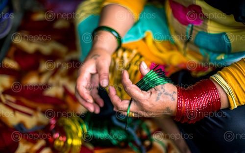 Find  the Image women,selling,bangles,shrawan,month,traditional,festival,kathmandu,nepal  and other Royalty Free Stock Images of Nepal in the Neptos collection.