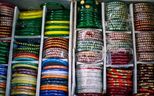 Find  the Image selling,bangles,shrwan,month,patan,nepal  and other Royalty Free Stock Images of Nepal in the Neptos collection.