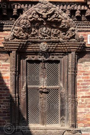 Find  the Image wood,carving,details,door,patan,durbar,square,nepal,world,heritage,site,declared,unesco  and other Royalty Free Stock Images of Nepal in the Neptos collection.