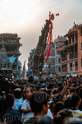 Find  the Image macchindranath,chariot,leaning,side,people,straight,photo,rato,red,jatra,celebrated,patan,lalitpur,nepal,honor,god,rain  and other Royalty Free Stock Images of Nepal in the Neptos collection.