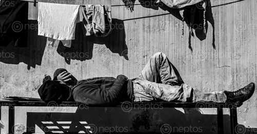 Find  the Image picture,boy,sleeping,bench,bright,sun,winter,season  and other Royalty Free Stock Images of Nepal in the Neptos collection.