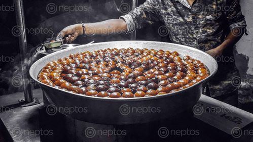 Find  the Image vendor,selling,sweets,night,income  and other Royalty Free Stock Images of Nepal in the Neptos collection.
