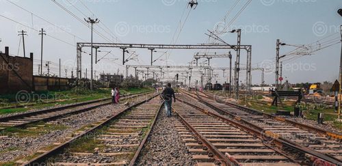 Find  the Image picture,man,walking,railway,tracks,raxaul,station  and other Royalty Free Stock Images of Nepal in the Neptos collection.