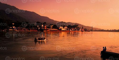 Find  the Image picture,people,sitting,bank,ganga,river,watching,boat,passing  and other Royalty Free Stock Images of Nepal in the Neptos collection.