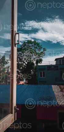 Find  the Image kathmandu,nepal,june,picture,wooden,window,frame,lit,morning,sun,showing,weather,view,house,baneshwor,area  and other Royalty Free Stock Images of Nepal in the Neptos collection.