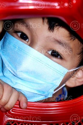 Find  the Image boy,wearing,face,mask,protected#,stock,image,nepal,photography,sita,maya,shrestha  and other Royalty Free Stock Images of Nepal in the Neptos collection.