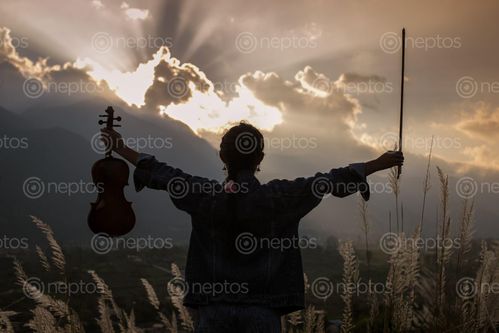 Find  the Image girl,violin,gloomy,sunset,kathmandu,nepal  and other Royalty Free Stock Images of Nepal in the Neptos collection.