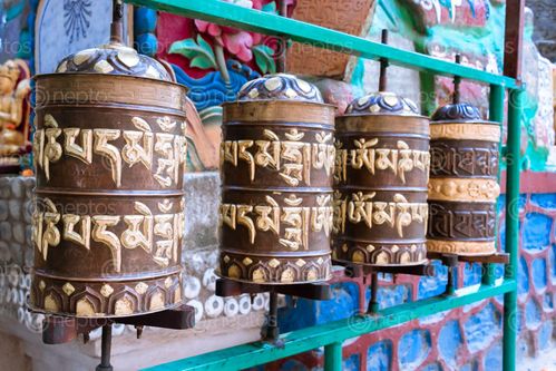 Find  the Image prayer,wheels,spinned,devotees,aid,meditation,accumulating,wisdom,good,karma,putting,negative,energy  and other Royalty Free Stock Images of Nepal in the Neptos collection.