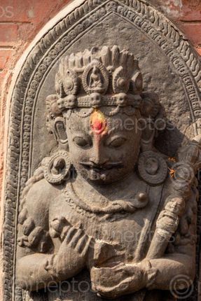Find  the Image statue,god,carved,swayambhunath,kathmandu,nepal  and other Royalty Free Stock Images of Nepal in the Neptos collection.