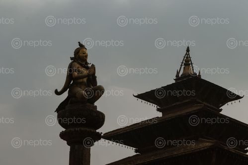 Find  the Image garuda,statue,hand,gesture,namaste,greeting,patan,durbar,square,nepal  and other Royalty Free Stock Images of Nepal in the Neptos collection.