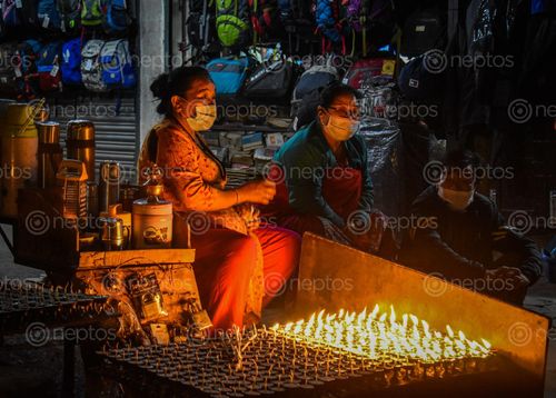 Find  the Image women,selling,tea,butter,lamps,evening,boudhanath,stupa  and other Royalty Free Stock Images of Nepal in the Neptos collection.