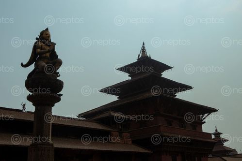 Find  the Image silhouette,view,garuda,statue,hand,gesture,namaste,greeting,patan,durbar,square,nepal  and other Royalty Free Stock Images of Nepal in the Neptos collection.