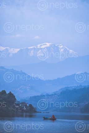 Find  the Image women,boating,begnas,lake,mt,annapurna,background  and other Royalty Free Stock Images of Nepal in the Neptos collection.