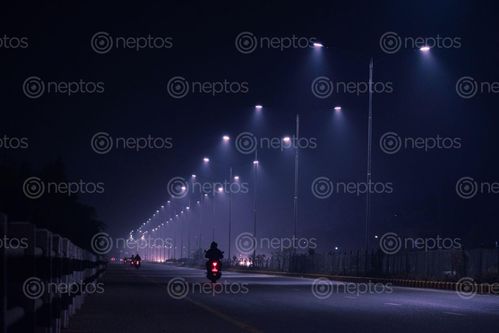 Find  the Image motorcyclist,siddhartha,highway,foggy,night  and other Royalty Free Stock Images of Nepal in the Neptos collection.