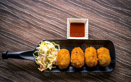 Find  the Image delicious,asian,fast-food,lunch,potato,cheese,ball,kathmandu,nepal  and other Royalty Free Stock Images of Nepal in the Neptos collection.