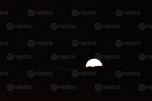 Find  the Image moon,half,blocked,clouds  and other Royalty Free Stock Images of Nepal in the Neptos collection.