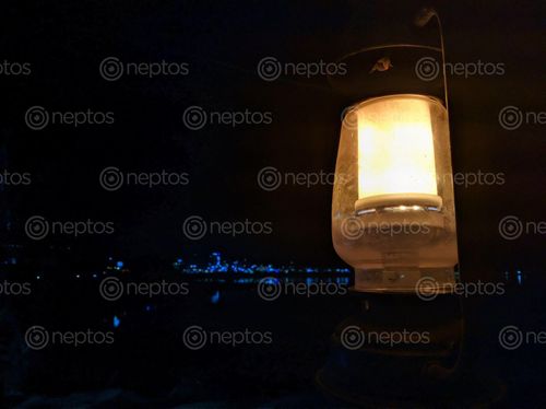 Find  the Image lantern,called,laltin,nepali,portable,source,lighting,typically,featuring,protective,enclosure,light,–,historically,candle,wick,oil,battery-powered,modern,times,make,easier,carry,hang,reliable,outdoors,drafty,interiors  and other Royalty Free Stock Images of Nepal in the Neptos collection.